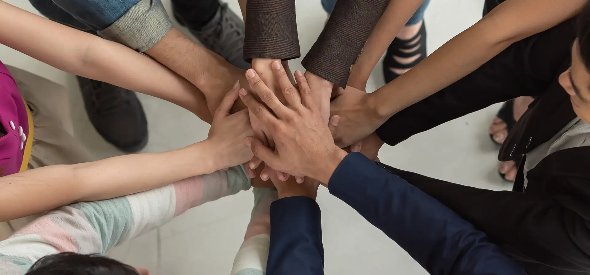 diverse team hands in an office